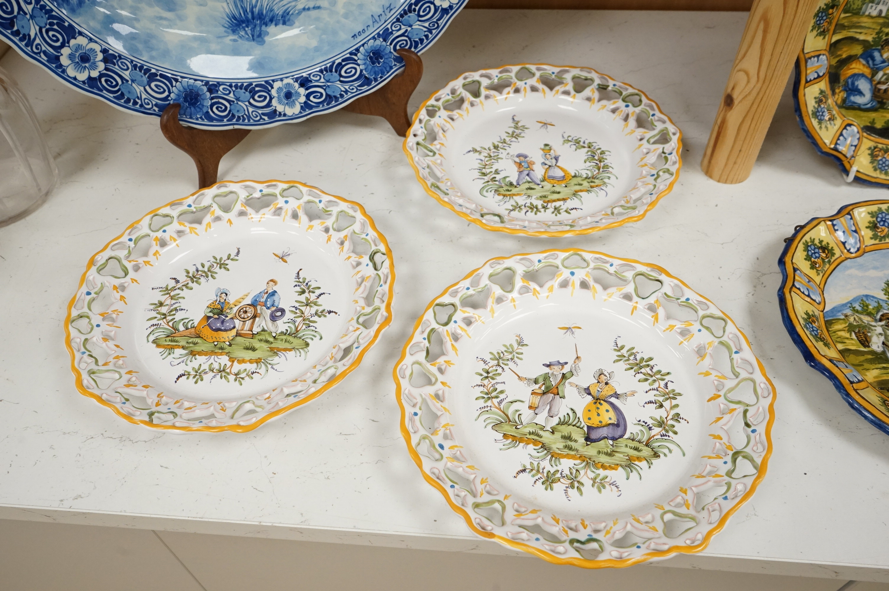 A Delft charger after Artz, together with other faience and majolica dishes, largest 41cm diameter (6)